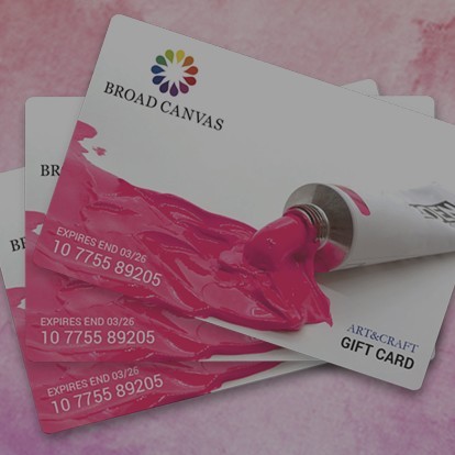 Pink and white gift cards displayed out on a table