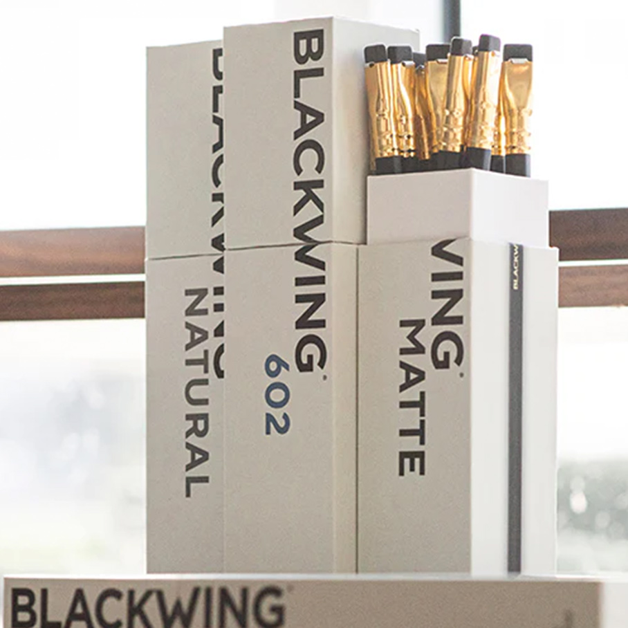 A box set of Blackwing pencils on a desk